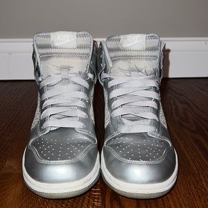 Nike woman’s silver, glitter high tops